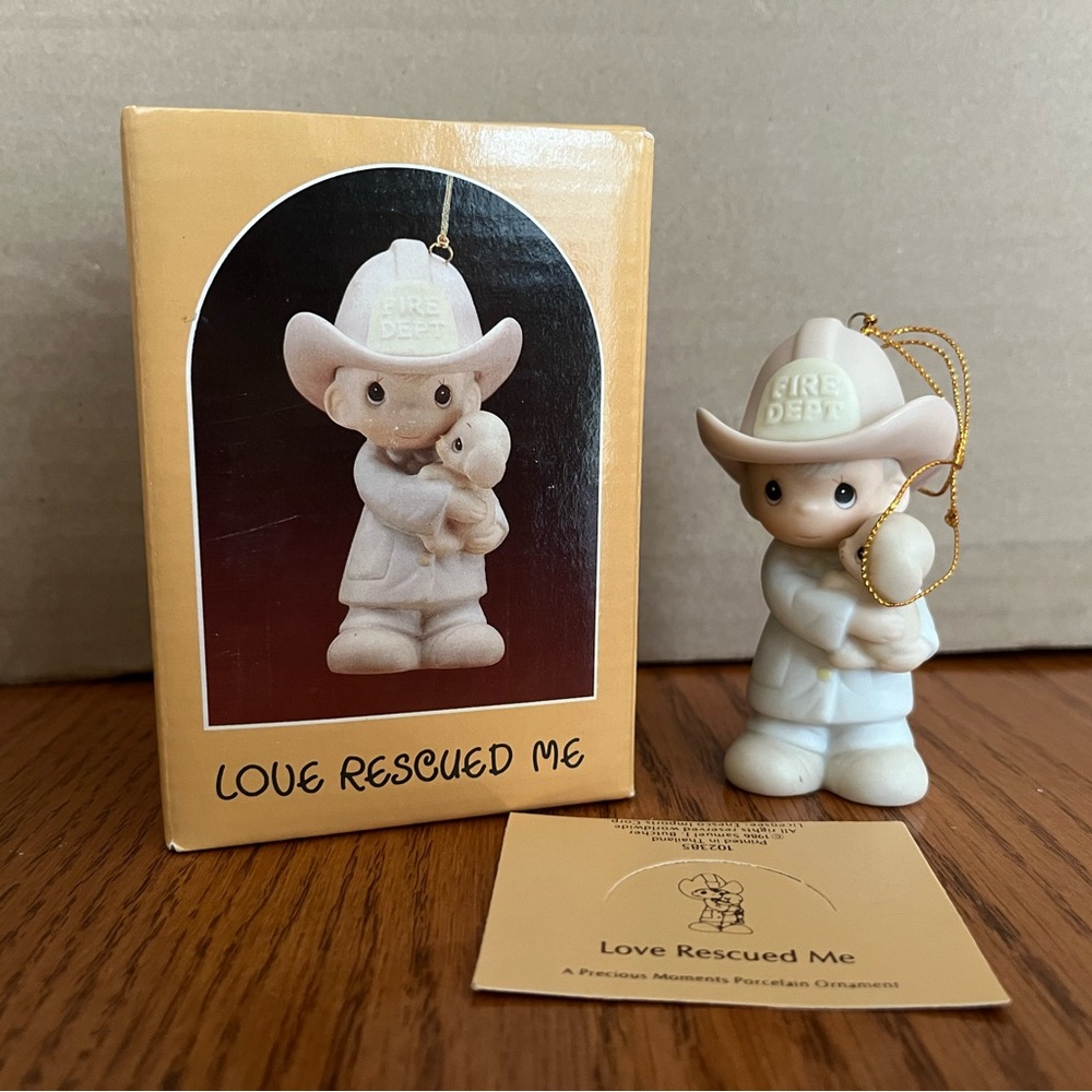 Precious Moments “Love Rescued Me” porcelain ornament.